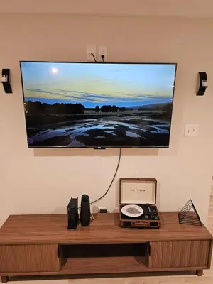 a flat screen tv hanging on a wall at Upscale New Construction Ranch in Middletown
