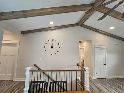a room with a clock on the wall at Upscale New Construction Ranch in Middletown