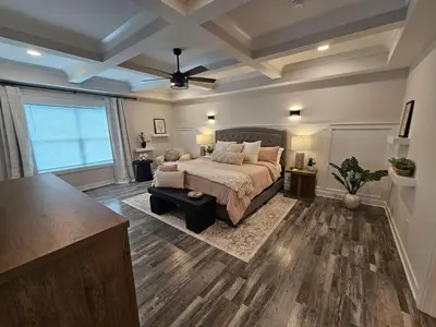 a large bedroom with a bed and a table at Upscale New Construction Ranch in Middletown