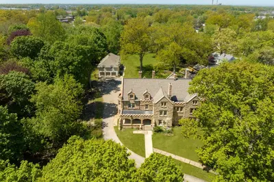 an aerial view of a large house with trees at Willoughby House Inn in Willoughby