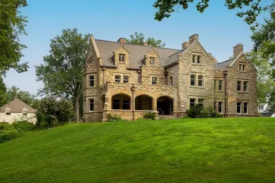 an old stone house on a grassy hill at Willoughby House Inn in Willoughby