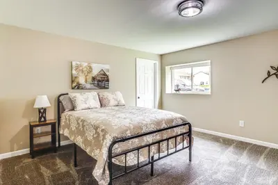 a bedroom with a bed and a window at 8 Mi to Ark Encounter Family Home with Deck and Grill in Dry Ridge