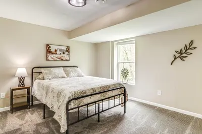a bedroom with a bed and a window at 8 Mi to Ark Encounter Family Home with Deck and Grill in Dry Ridge