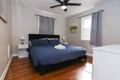 a bedroom with a bed with a stuffed animal on it at New Charloe Court 3 Bed Family House in Cincinnati