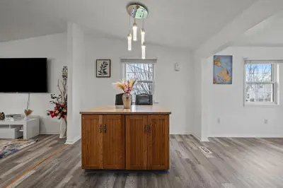 a living room with a island in the middle at Cosy house, home away from home in Grove City