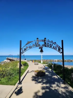 an arch over a walkway near the beach at Cozy Euclid Home Near Lakefront in Euclid