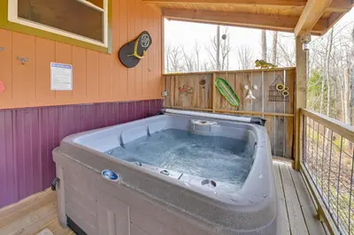 a large tub in a house with a window at Bring a Pet Peaceful Frenchburg Cabin on 1 Acre in Frenchburg