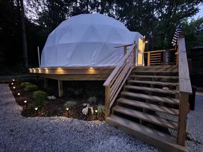 a dome tent on a set of stairs with lights at Bunny Bungalow Romantic Getaway in a Spacious Geodome in New Straitsville
