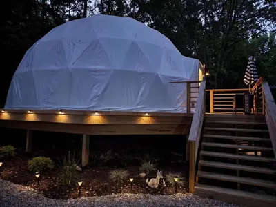 a dome tent on a deck with stairs at Bunny Bungalow Romantic Getaway in a Spacious Geodome in New Straitsville