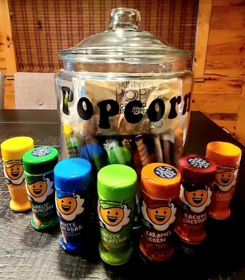 a jar of dip and a group ofcolored bottles of candy at Deer Haven Cabin in New Straitsville