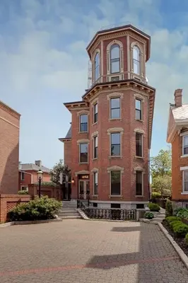 a tall brick building with a tower on top of it at Schwartz Castle in Columbus
