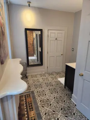 a hallway with a door and a mirror at Schwartz Castle in Columbus