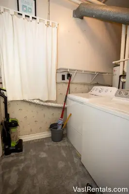 a laundry room with a washing machine and a window at Cooper 2 Bed 1 Bath in Blue Ash Family Home in Cincinnati