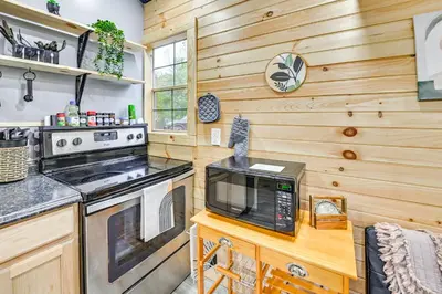 a kitchen with a stove and a microwave at Hot Tub, Fire Pit Lake-View Catlettsburg Getaway! in Catlettsburg