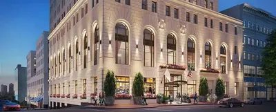 a large building on the corner of a street at CozySuites at Sky Central in Cincinnati
