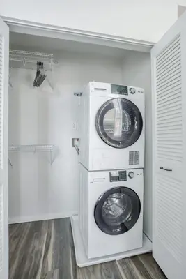 a laundry room with a washer and dryer at CozySuites at Sky Central in Cincinnati
