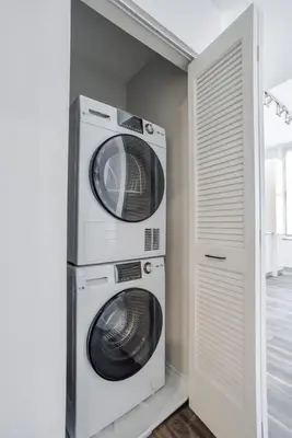 two dryers stacked on top of each other in a room at CozySuites at Sky Central in Cincinnati
