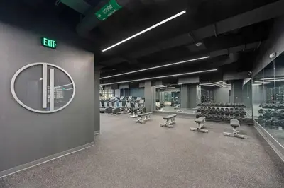 a gym with rows of chairs and a mirror at CozySuites at Sky Central in Cincinnati
