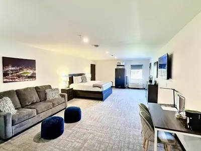 a living room with a couch and a bed at The 419 Ten-Room Boutique in Sandusky in Sandusky