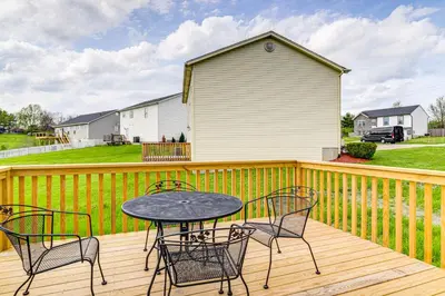 a patio with a table and chairs on a deck at Deck and Outdoor Dining Family Getaway in Dry Ridge in Dry Ridge