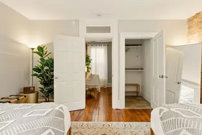 a bedroom with a bed and a room with a table at Walk to OSU & Short North FREE PARKING Fire Pit in Columbus