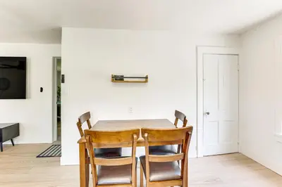 a dining room with a table and chairs at 3 Mi to Downtown Youngstown Apt with Deck! in Youngstown