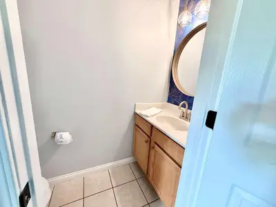 a bathroom with a sink and a mirror at 4 apartments 10 bedrooms - 2 and a half Miles from Ark in Williamstown