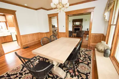 a dining room with a wooden table and chairs at Nature Valley Farm- 2BD/1BA on private 53 acres in North Lawrence