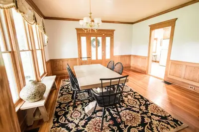 a dining room with a table and chairs at Nature Valley Farm- 2BD/1BA on private 53 acres in North Lawrence