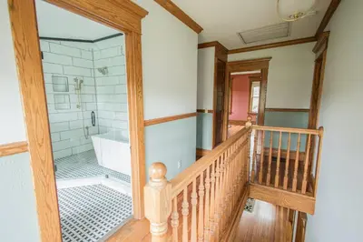 a bathroom with a walk in shower and a tub at Nature Valley Farm- 2BD/1BA on private 53 acres in North Lawrence