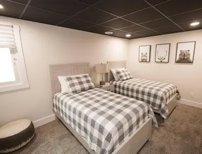 a bedroom with two beds and a window at Sherwood Forest Park- 6BD/3BA on Private Ohio Land in North Lawrence