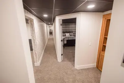 a hallway with a room with a bed in it at Sherwood Forest Park- 6BD/3BA on Private Ohio Land in North Lawrence