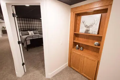 a hallway with a door leading to a bedroom at Sherwood Forest Park- 6BD/3BA on Private Ohio Land in North Lawrence