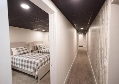 a bedroom with two beds and a hallway at Sherwood Forest Park- 6BD/3BA on Private Ohio Land in North Lawrence