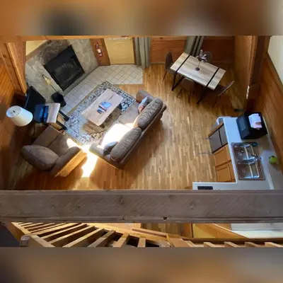 an overhead view of a living room with a couch at A-Frame #16 - by The Chalets in Logan