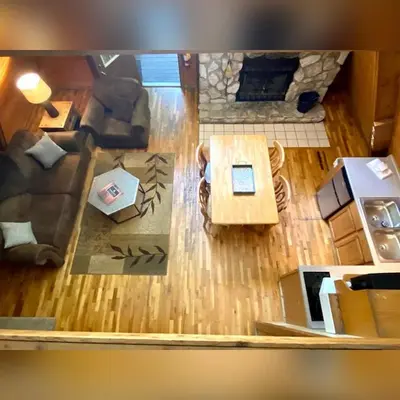an overhead view of a living room with a couch at A-Frame #15 - by The Chalets in Logan