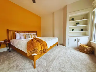 a bedroom with a bed with a blanket on it at Jungle House Luxury Stays - Columbus Downtown Short North in Columbus