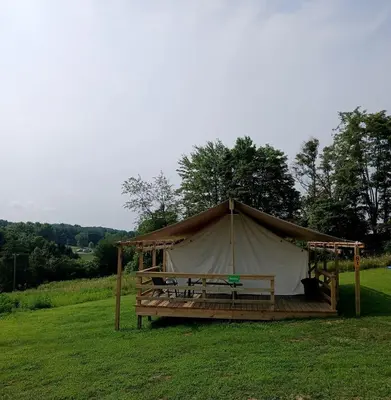a gazebo in the middle of a field at Fantastic Secluded Tented Cabin with Fire Pit in Logan, Ohio in Logan