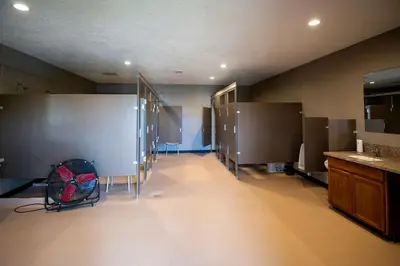a large room with stalls in a bathroom at Fantastic Secluded Tented Cabin with Fire Pit in Logan, Ohio in Logan