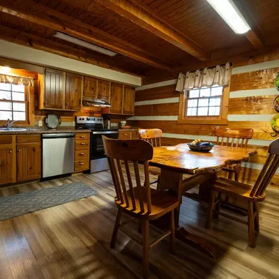 a large kitchen with a wooden table and chairs at Alpine - by The Chalets in Logan