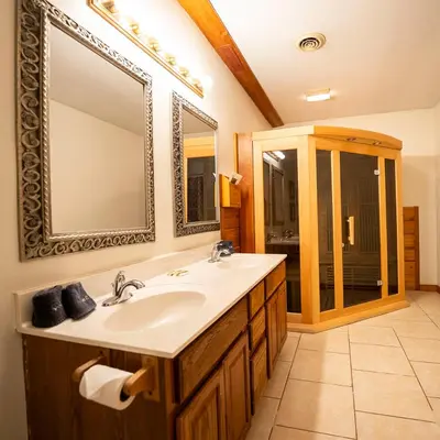 a bathroom with a sink and a mirror at Blackjack - by The Chalets in Logan