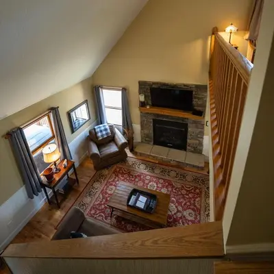 an overhead view of a living room with a fireplace at Couples Paradise I - by The Chalets in Logan