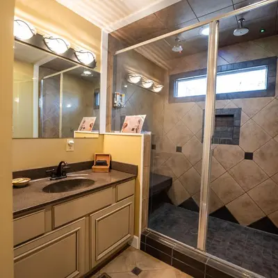 a bathroom with a sink and a shower at Couples Paradise I - by The Chalets in Logan