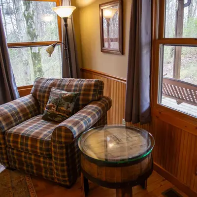 a living room with a couch and a coffee table at Couples Paradise II - by The Chalets in Logan