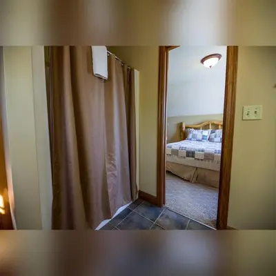 a mirror in a room with a bed in a bedroom at Coyote - by The Chalets in Logan