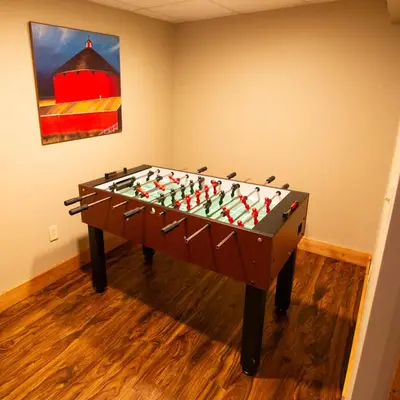 a table with a chessboard in a room at Dogwood - by The Chalets in Logan