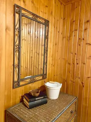 a room with a mirror and a table with a bowl at Elk - by The Chalets in South Bloomingville