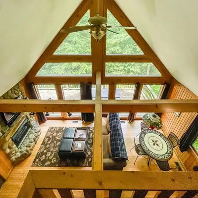 an overhead view of a living room with a large window at Falls - by The Chalets in Logan