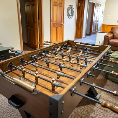 a large wooden table with a large wooden at Fallswood Lodge - by The Chalets in Logan