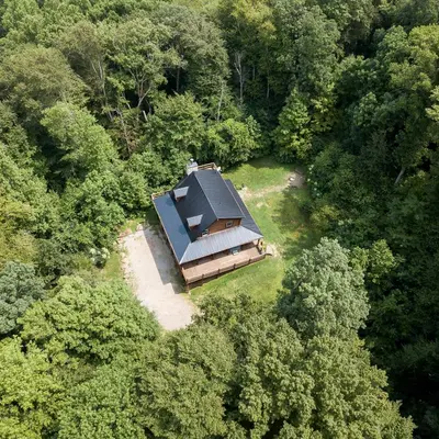an overhead view of a house in the middle of a forest at Hidden Heights - by The Chalets in South Bloomingville